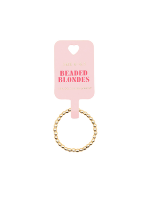 Beaded ring on a pink card with 'Beaded Blondes' branding. 
