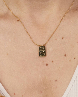 Necklace with a pendant on a person's neck