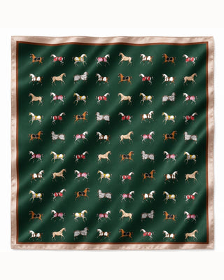 A square silk scarf featuring a dark green background printed with a grid of various horse illustrations in different colors, finished with a beige satin border.