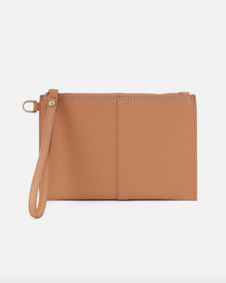 Brown leather clutch with a strap on a light gray background