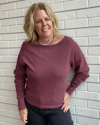 Long Sleeve in a washed burgundy, a textured cotton thermal with a flattering boat neckline and relaxed dolman sleeves.