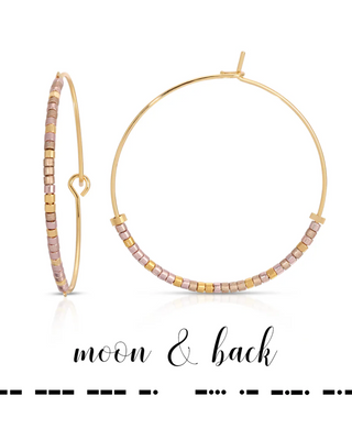 Gold hoop earrings with pink and gold beads on a white background, featuring 'moon & back' branding.