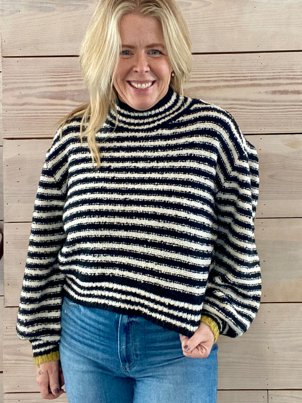 Black and white stripe sweater with mustard yellow cuffs