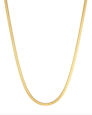 Gold chain necklace on a white background