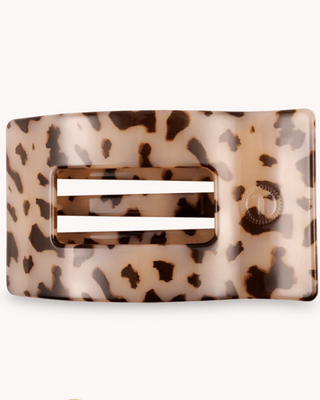 Leopard print belt buckle on a white background