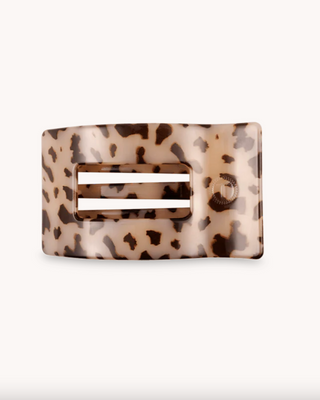 Leopard print hair clip on a white background