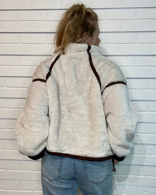 Vintage Havana beige sherpa quarter zip jacket with brown contrast binding, relaxed fit, and kangaroo pocket