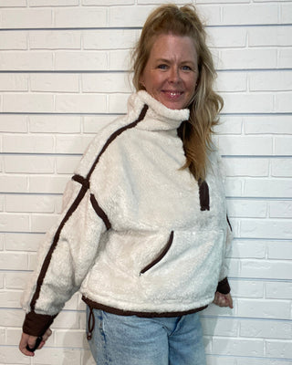 Vintage Havana beige sherpa quarter zip jacket with brown contrast binding, relaxed fit, and kangaroo pocket