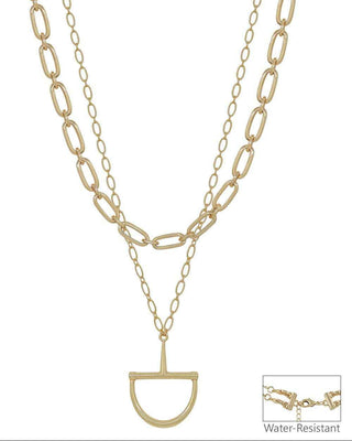 Gold-tone layered necklace featuring a paperclip chain, a link chain, and a short chain with a D-shaped pendant, shown on a white background with a small inset showing the water-resistant clasp detail.