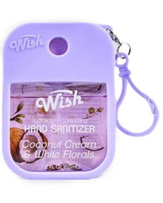 A purple Wish brand hand sanitizer dispenser case with a wrist strap, featuring a clear window showing the coconut cream and white florals hand sanitizer inside.
