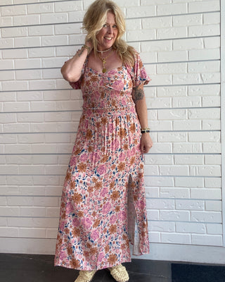 Women's floral sweetheart crop top with a square neckline, flowy sleeves, smocked back, and multicolor floral print matching set