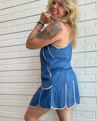Women's slate blue linen blend halter tank with cream shell panel trim, adjustable knot straps, and a lightweight relaxed fit side picture