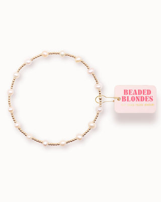 Beaded hair clip with 'Beaded Blondes' packaging on a white background