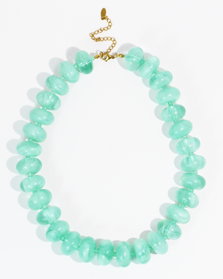 aqua beaded necklace on a white background