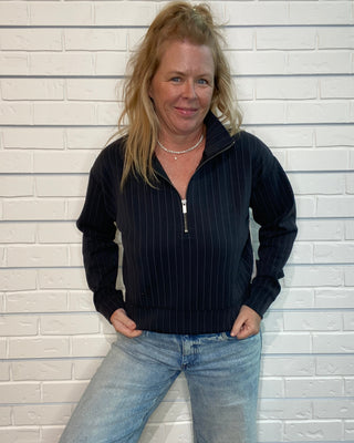 cropped raglan jacket with a quarter zipper and ribbed trim.
