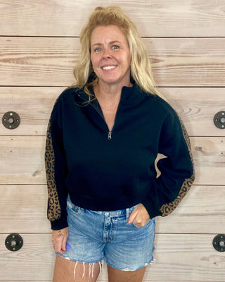 black sweatshirt with leopard sleeves