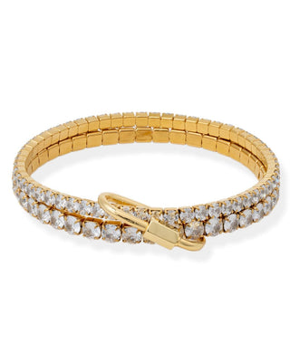 Gold bracelet with diamond accents on a white background