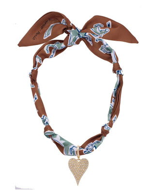 Decorative scarf necklace with a heart-shaped pendant on a white background