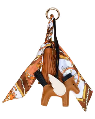 Keychain with horse design and patterned fabric on a white background