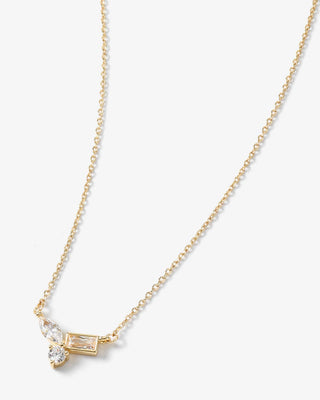 A delicate gold chain necklace featuring a small butterfly pendant with clear baguette and round gemstones, displayed on a clean white background.