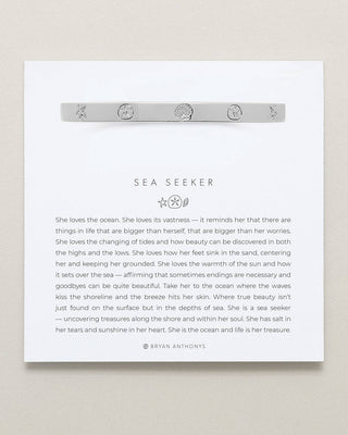 Textual description of a 'Sea Seeker' poem with a bracelet on a white background