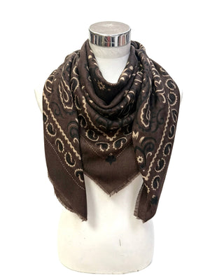 A brown square scarf with a beige paisley pattern, draped on a white mannequin torso against a white background.