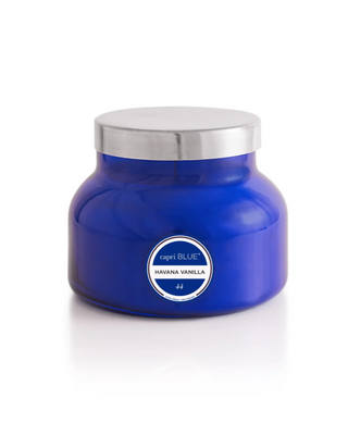 Blue candle jar with silver lid on a white background