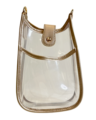 A clear plastic handbag with gold hardware and vegan leather detailing, designed to hold a phone.