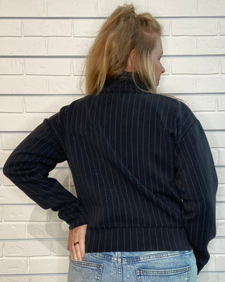 cropped raglan jacket with a quarter zipper and ribbed trim.