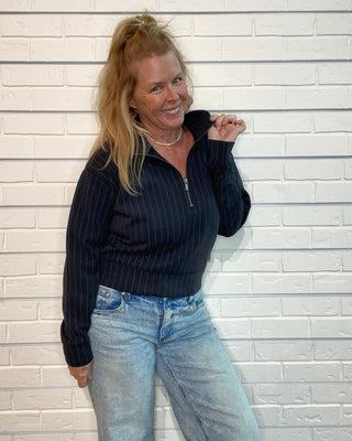cropped raglan jacket with a quarter zipper and ribbed trim.