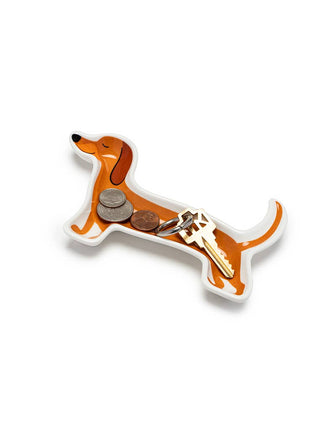 Dog-shaped keychain organizer with coins and keys on a white background