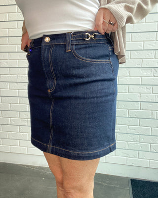 Z Supply Socialite Denim Mini Skirt in Midnight Air. A dark indigo stretch denim mini with five pockets and classic gold hardware.