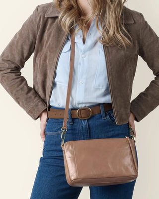 women with a leather crossbody bag