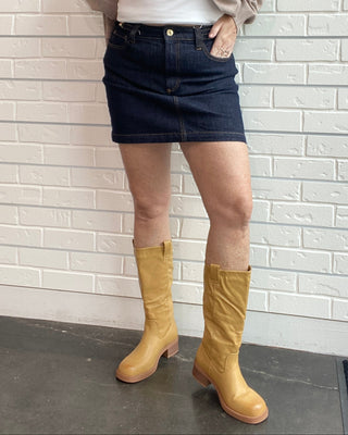 Z Supply Socialite Denim Mini Skirt in Midnight Air. A dark indigo stretch denim mini with five pockets and classic gold hardware.