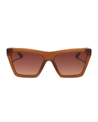A pair of cat-eye sunglasses with a translucent amber-brown acetate frame and matching gradient brown lenses, shown against a plain white background.