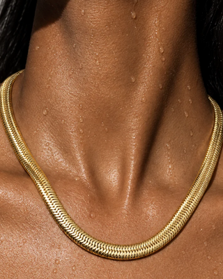 Ellie Vail Rima water-resistant stainless steel snake chain necklace with 8mm width and adjustable chain length.

