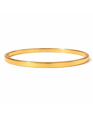 Gold bangle on a white background
