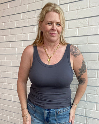 woman wearing a gray fitted tank top