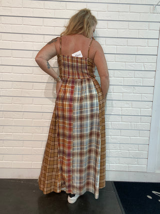 A flowy fall maxi dress with warm plaid, adjustable straps, smocked back