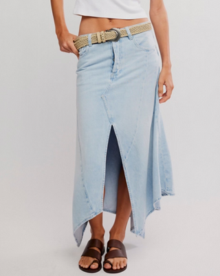 Light blue denim skirt worn by a person on a plain background