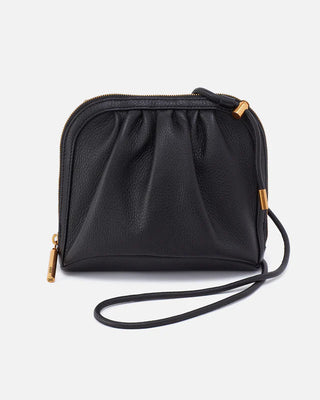 Black leather crossbody bag with gold zipper on a white background