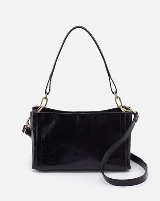 Black leather handbag with a shoulder strap on a white background