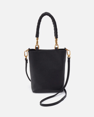 Black handbag with gold accents on a white background