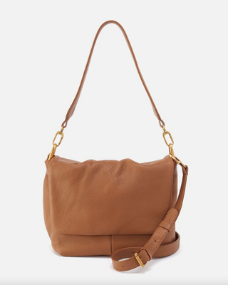 Brown leather handbag with gold chain detail on a white background
