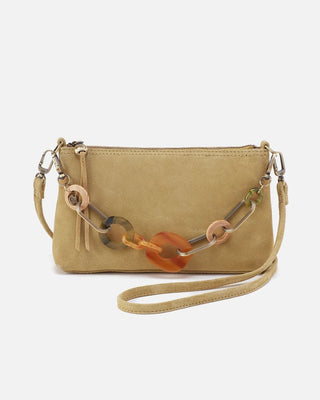 Beige handbag with a decorative chain on a white background