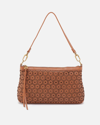 Brown handbag with geometric cut-out design on a white background