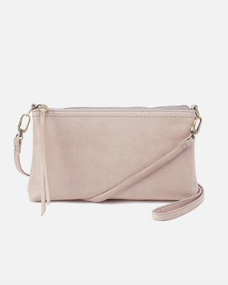 Beige crossbody bag on a light background