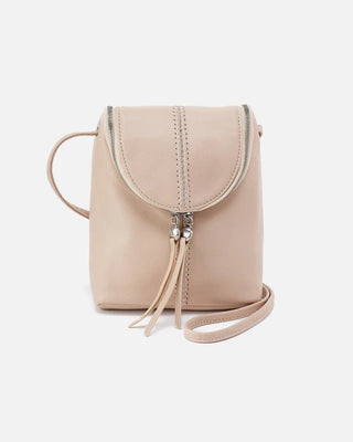 Beige handbag with a strap on a light gray background