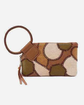 Patterned clutch bag with a strap on a light gray background