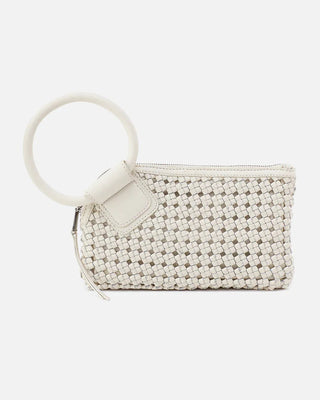 White woven clutch bag with a circular handle on a white background